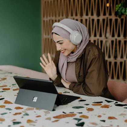 Sister waving in a live online class